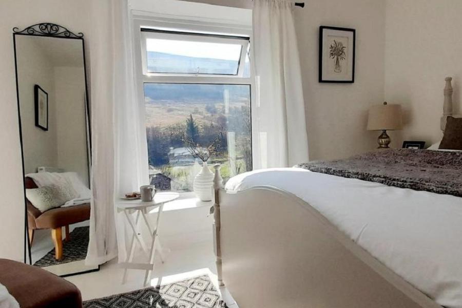 Bedroom with views at Parc Cottage