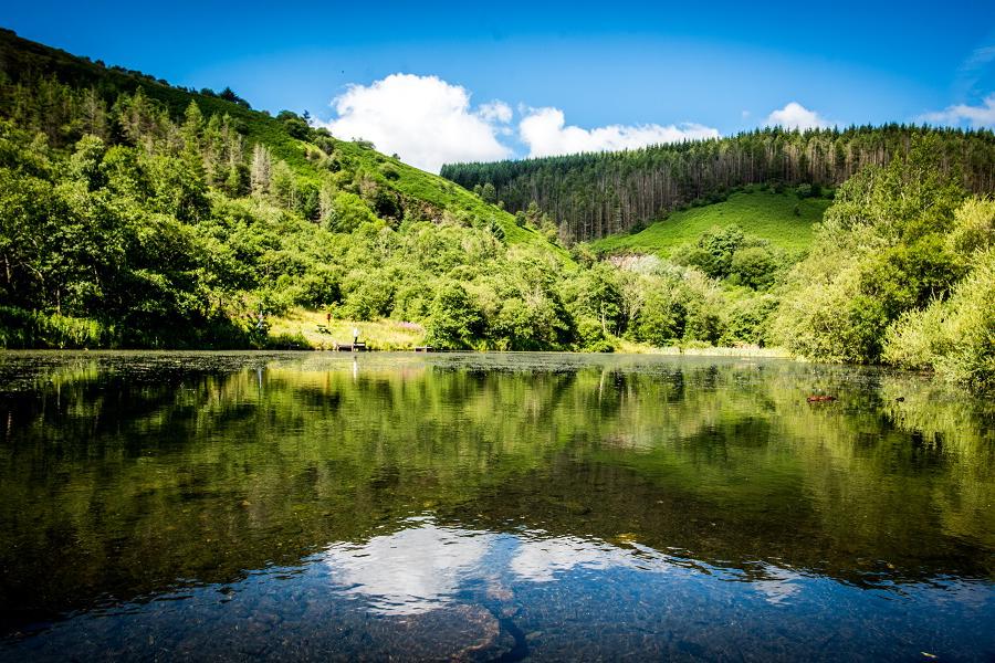 The lake and surrounding scenery at Cwm Clydach Countryside Park