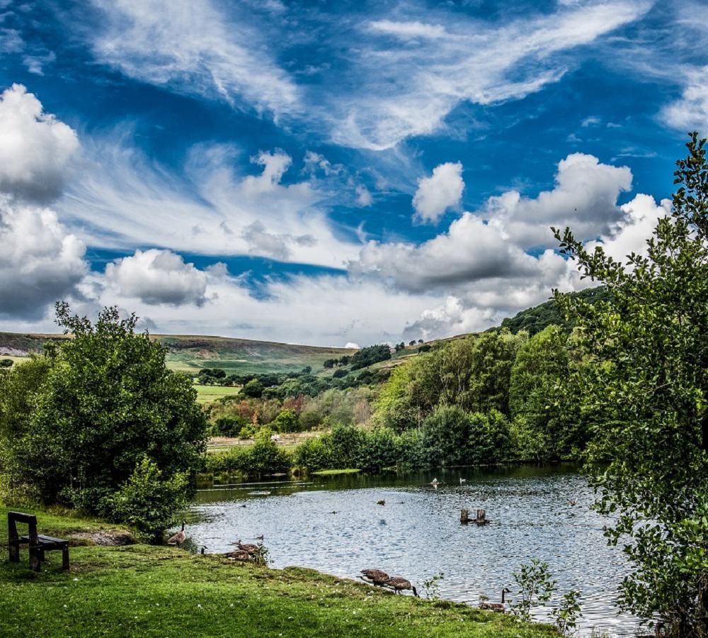 Sunshine and clouds over one of the lakes at Dare Valley Country Park