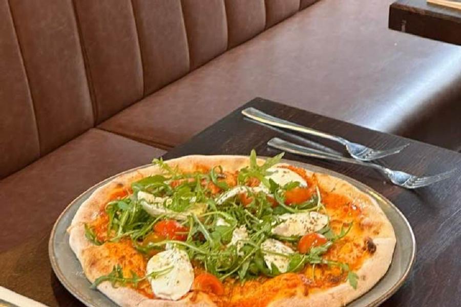 Fresh pizza at Amore Italian