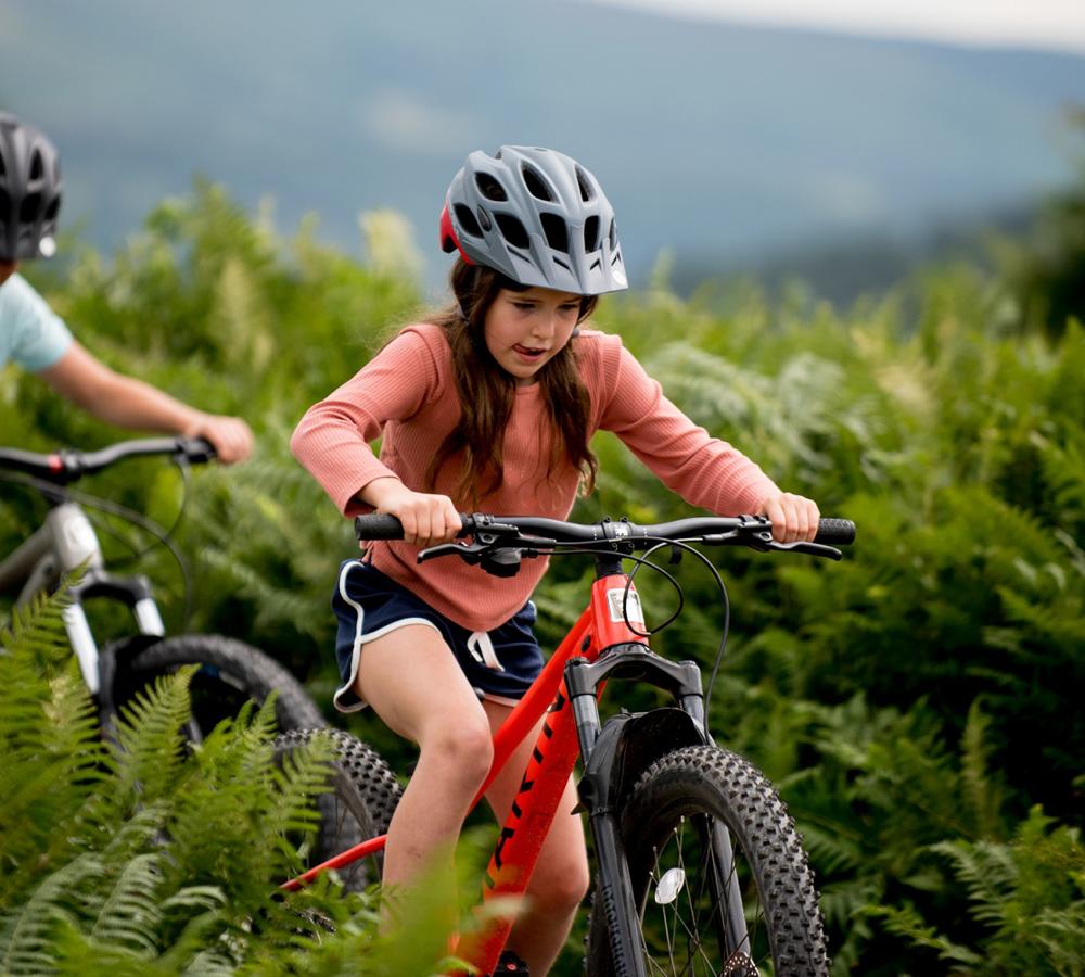 Children ride their bikes on Gravity at Dare Valley Country Park